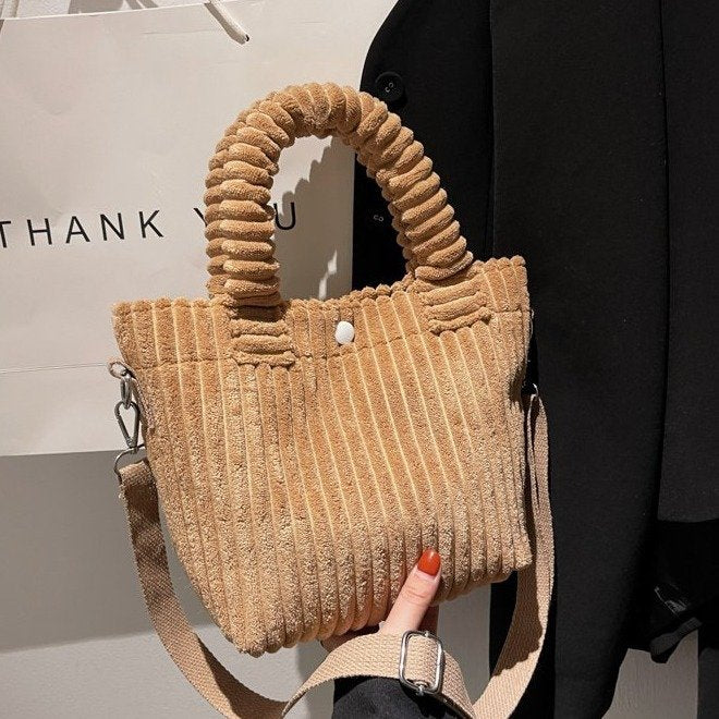 Plush shoulder bag with a slanted strap