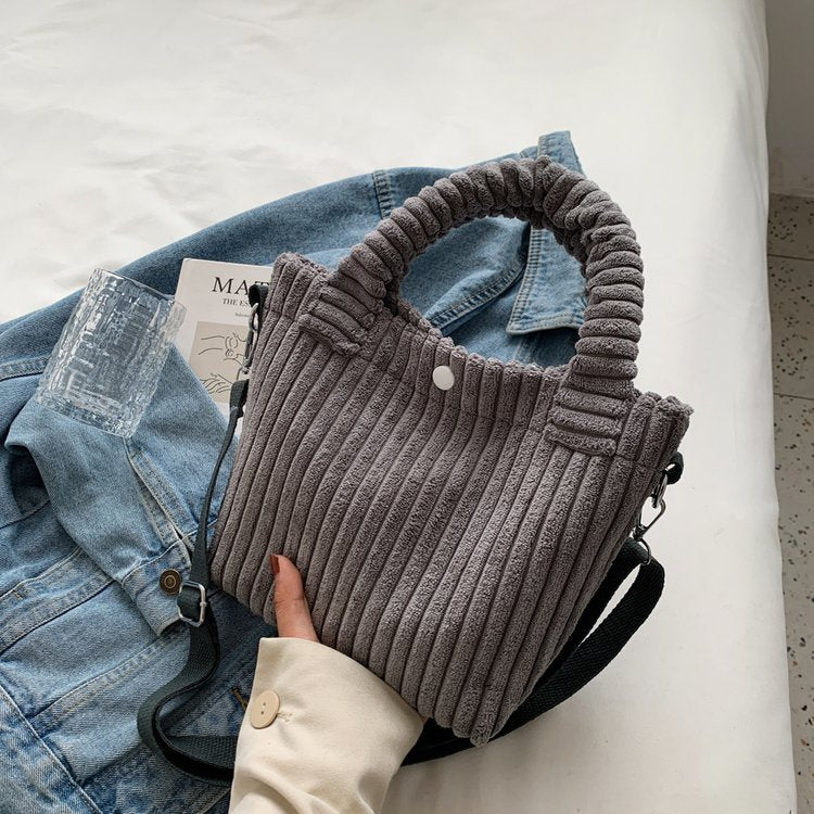 Plush shoulder bag with a slanted strap