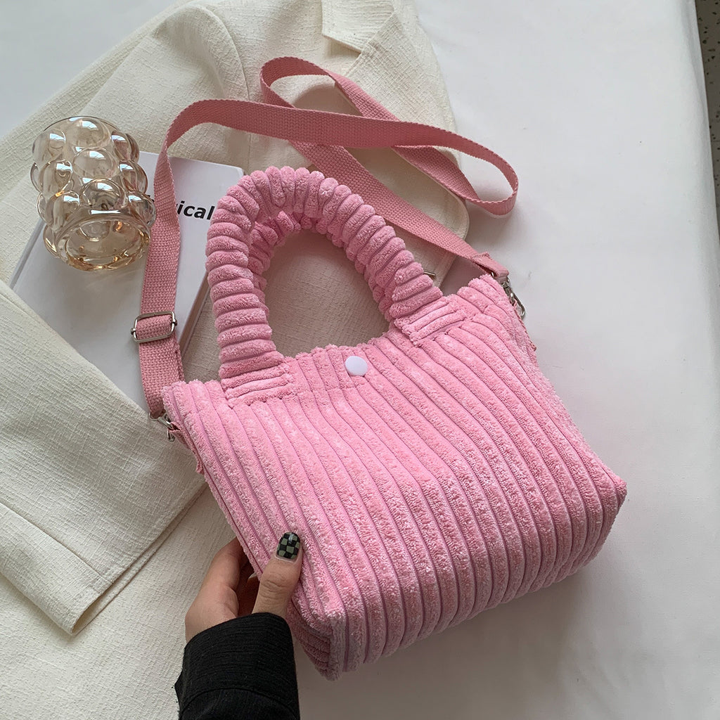 Plush shoulder bag with a slanted strap