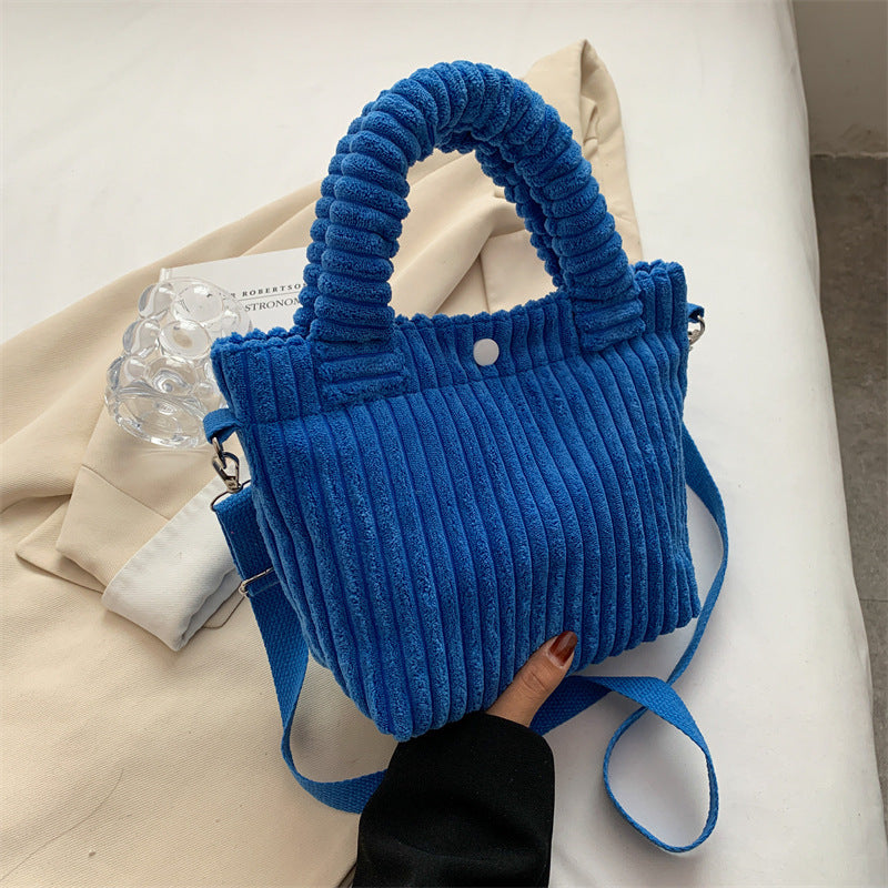 Plush shoulder bag with a slanted strap