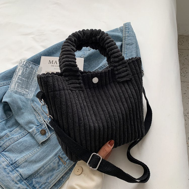 Plush shoulder bag with a slanted strap