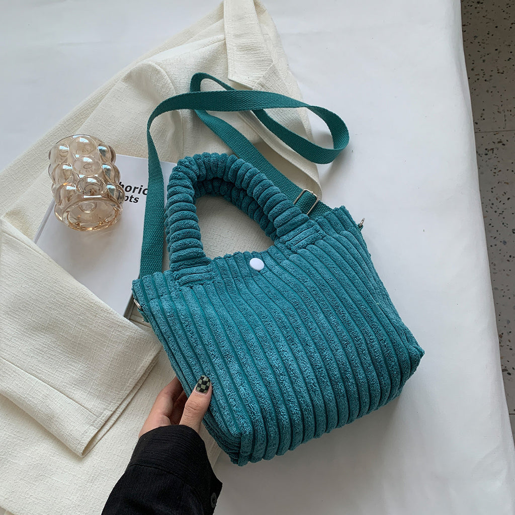 Plush shoulder bag with a slanted strap