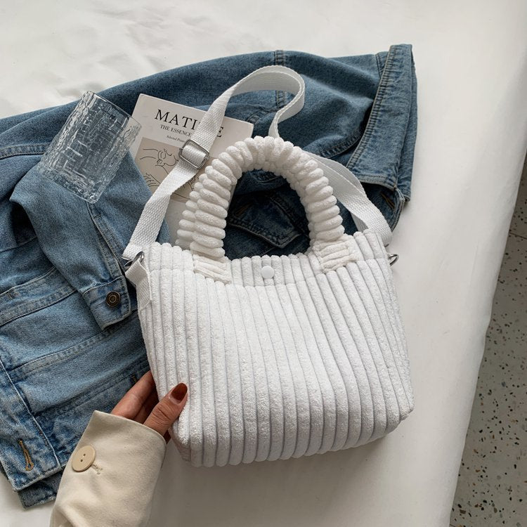Plush shoulder bag with a slanted strap
