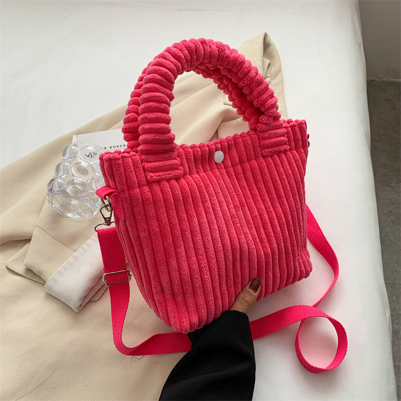 Plush shoulder bag with a slanted strap